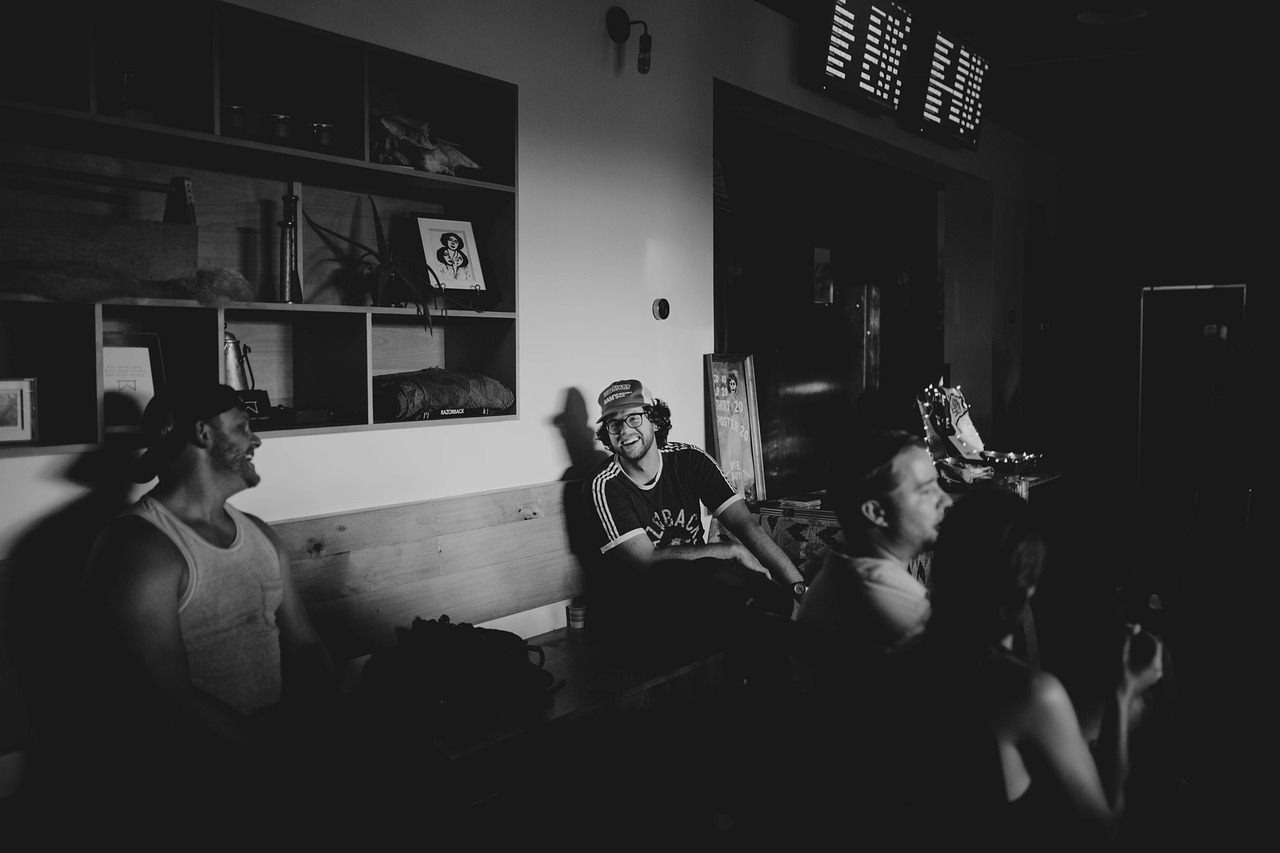 black white party gathering people laughing
